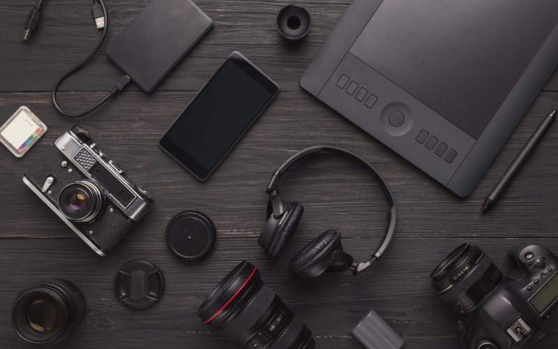 Photo equipment. Top view of diverse personal equipment for photographer or creative designer, copy space
